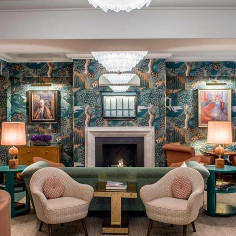 Luxury hotel fireplace installation London at Bloomsbury Hotel lobby with open gas fire and bespoke surround