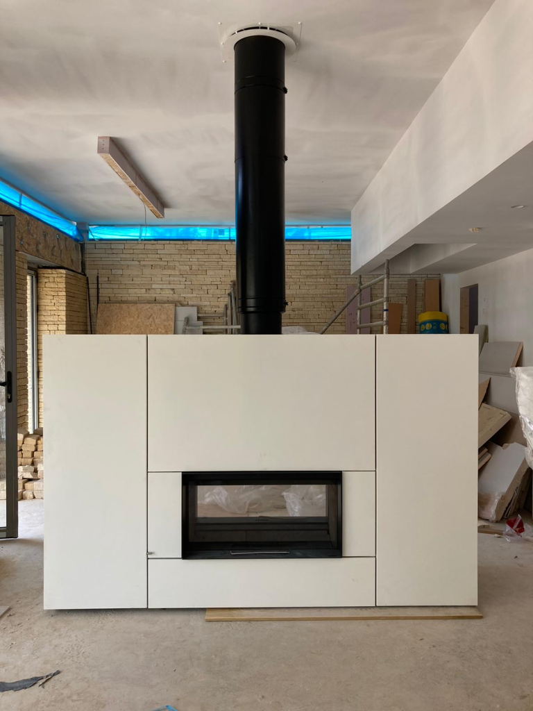 Stûv 22/110 double sided wood burning fireplace with white cladding installed in Reading