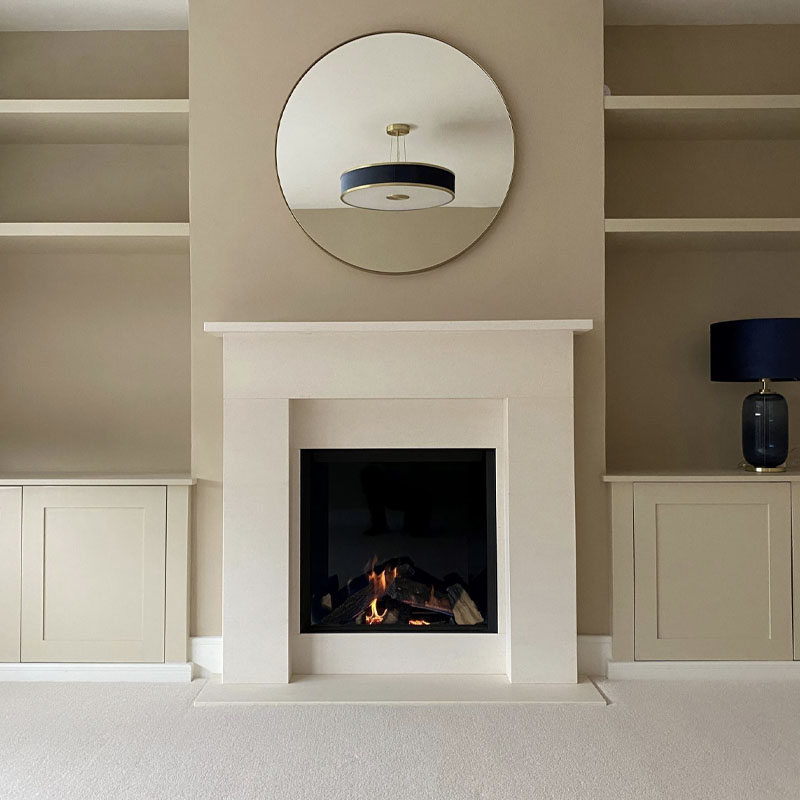 Final picture of limestone fireplaces and gas fire installation in clients living room.