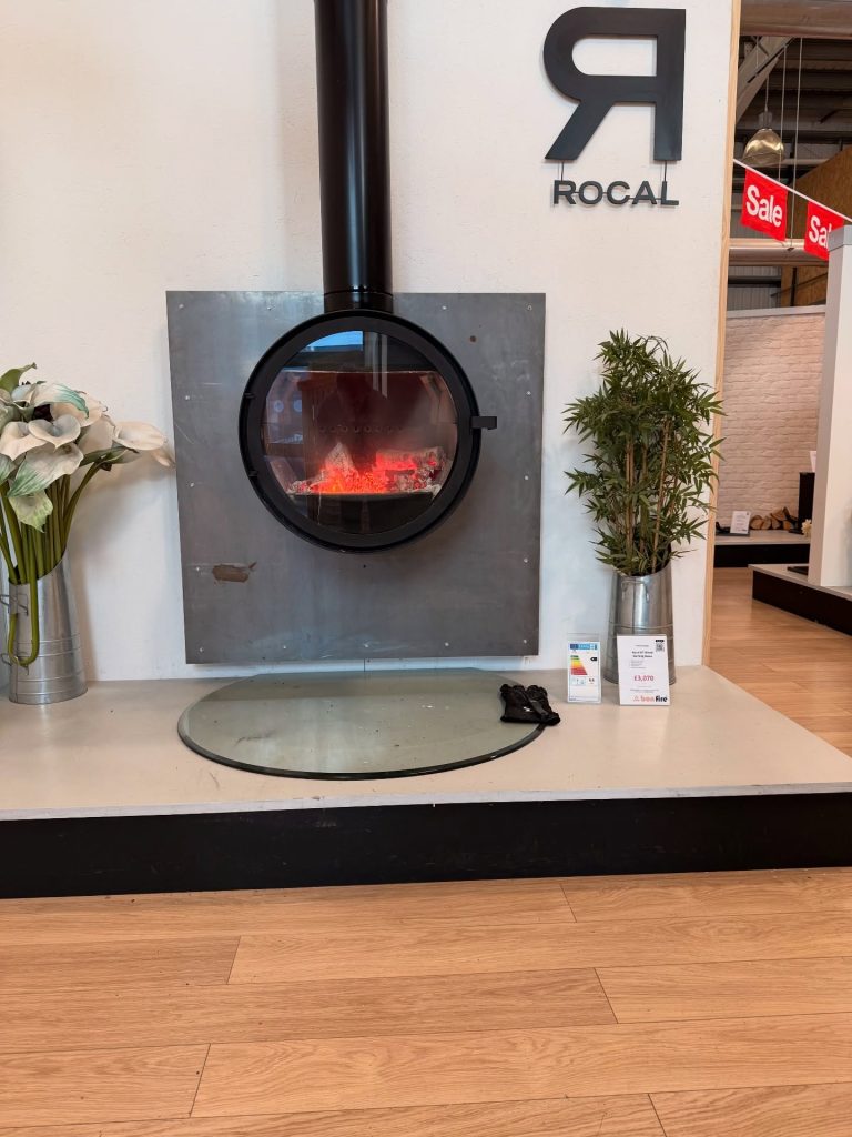 Wall mounted wood burning stove view and Rocal display