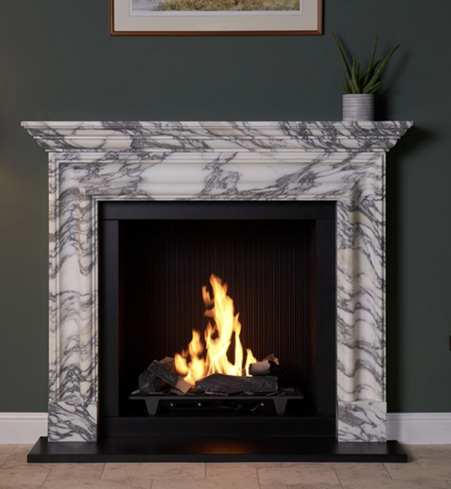 marble fireplace with burning fireplace in the middle.