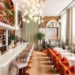 Bioethanol fireplace installation at Amélie Restaurant London with limestone surround and inset open-fronted fire