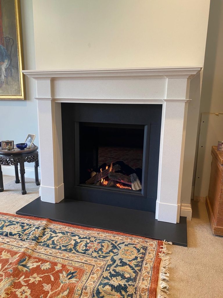 Gazco Eclipse 60HL inset gas fire with bespoke limestone fireplace surround and granite hearth in Oxfordshire