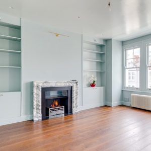 Arabescato marble fireplace with matching hearth slip set and glass shade screen in Fulham