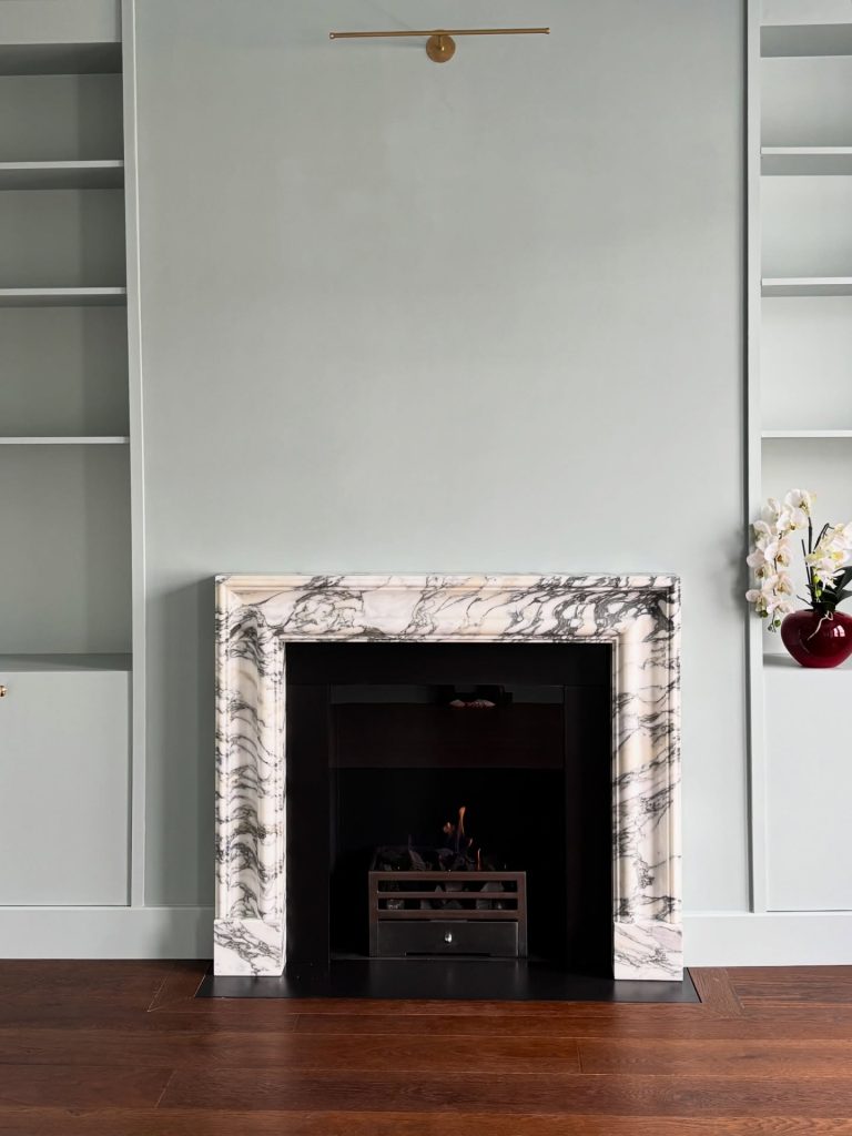Bolection style natural marble fireplace in polished Arabescato marble for a Fulham home