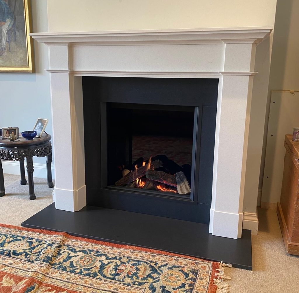 Gazco Eclipse 60HL inset gas fire with bespoke limestone fireplace surround and granite hearth in Oxfordshire