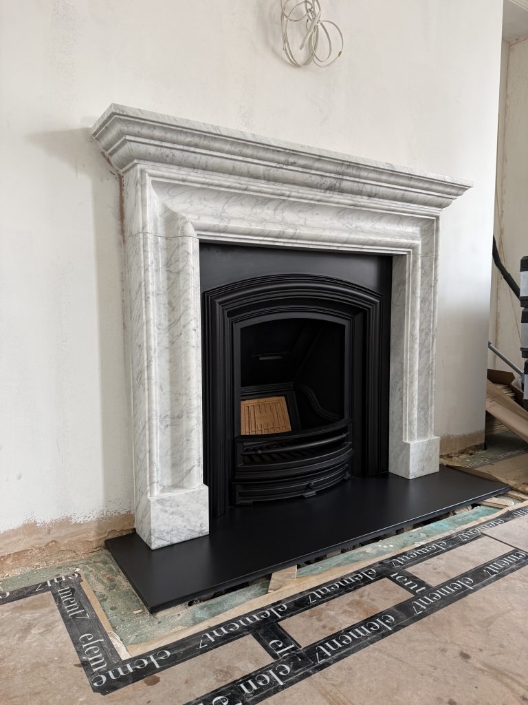 Salisbury Bolection fireplace in honed Carrara marble installed in Mayfair London